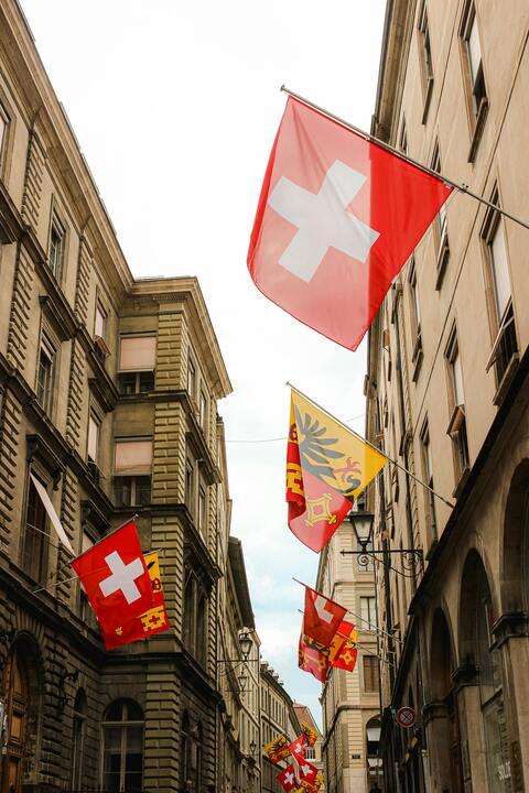 Geneva old town swiss cantonal flags — Wyoming SPDI Charter: Crypto Banking License 2026