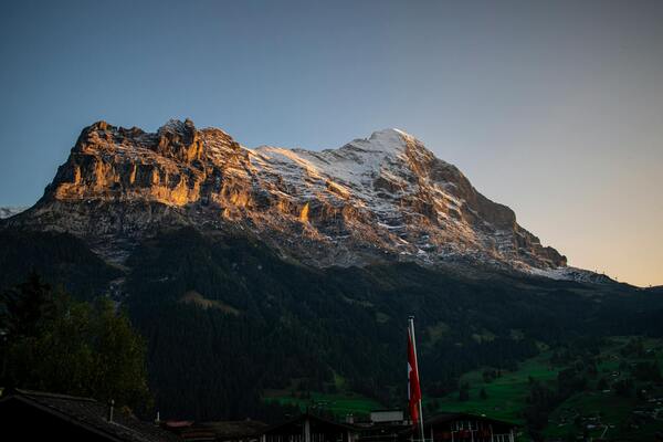 Swiss alps eiger sunset flag — Kazakhstan Crypto License: AIFC AFSA Digital Asset 2026