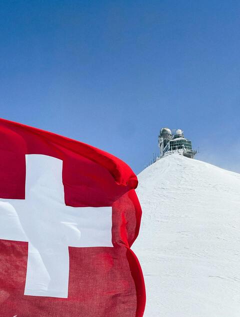 Swiss flag jungfraujoch snow peak — UK Crypto Regulation 2026: FCA Registration & Financial 
